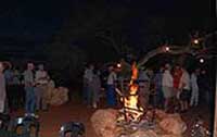 Guests enjoying the traditional bonfire at Hartebeestloop.